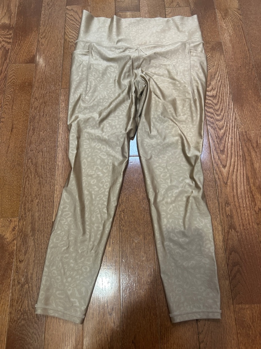 Athleta Gold Embossed Salutation 7/8 Tights